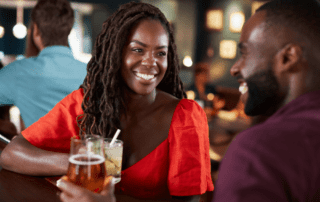 Photo of a Couple Enjoying Drinks. Romance in Fredericksburg, TX, is a Natural Occurrence.