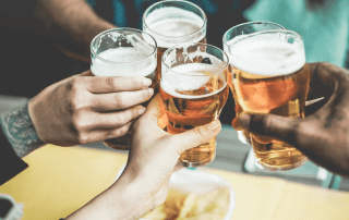 Photo of 4 People Toasting at a Fredericksburg Brewery.