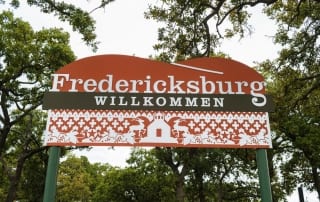The Fredericksburg town sign welcomes you to the town anniversary in the heart of Texas Hill Country
