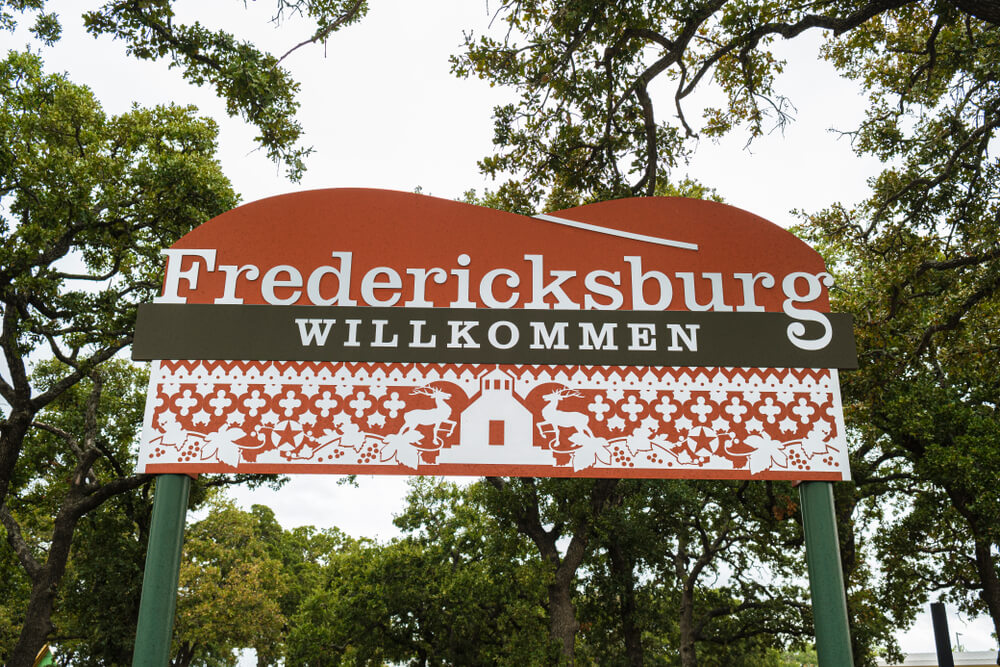 The Fredericksburg town sign welcomes you to the town anniversary in the heart of Texas Hill Country