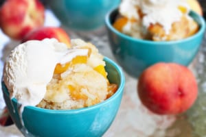 Fredericksburg Peach offers up some tasty peach seaonsal dishes, like this peach cobbler with ice cream. 