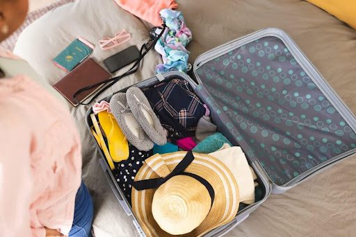 A woman is using her vacation packing list.
