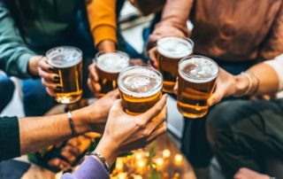 Friends Raising a Glass at one of the Best Bars in Fredericksburg, TX
