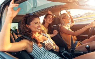 Friends in a car on their way to their girls’ getaway in the Texas Hill Country