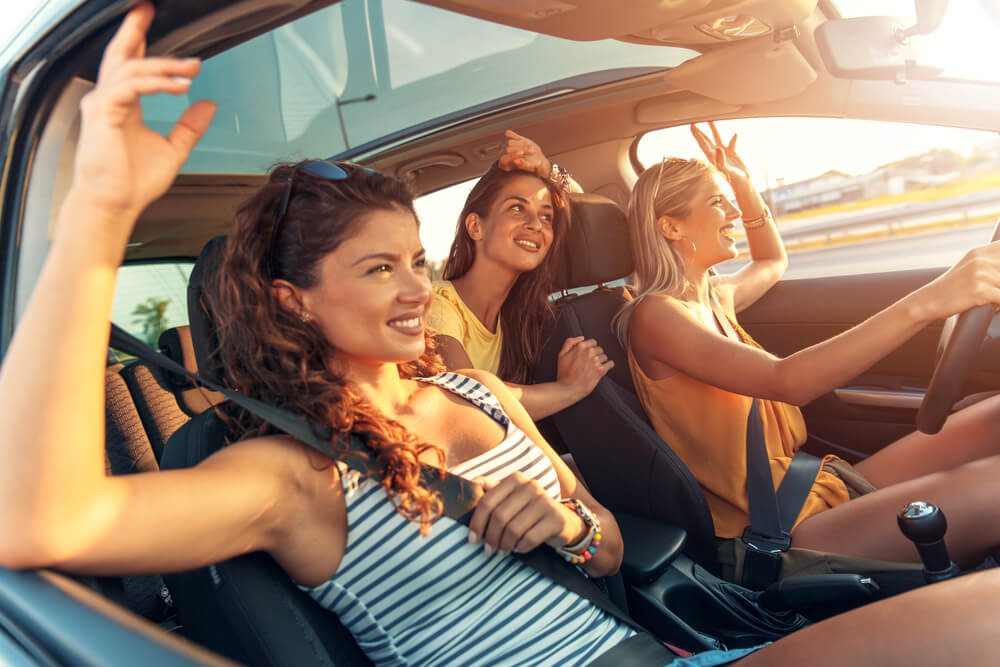 Friends in a car on their way to their girls’ getaway in the Texas Hill Country